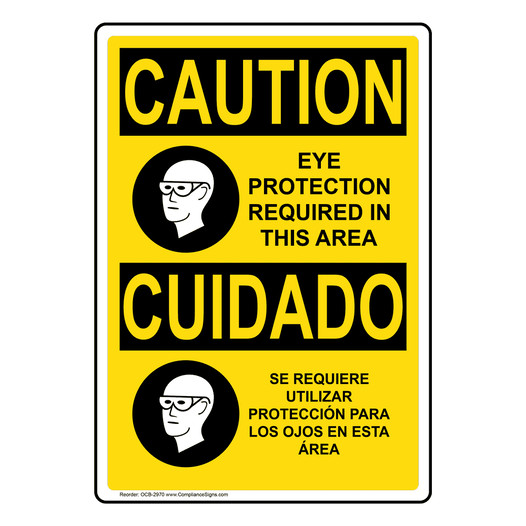 English + Spanish OSHA CAUTION Eye Protection Required Sign With Symbol OCB-2970