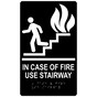 Black ADA Braille IN CASE OF FIRE USE STAIRWAY Sign with Symbol RRE-235_White_on_Black