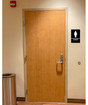 Black and White Braille Women's Restroom Sign at Bathroom Door