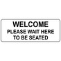White Engraved WELCOME PLEASE WAIT HERE TO BE SEATED Sign EGRE-15821_Black_on_White