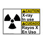 English + Spanish ANSI CAUTION X-Ray In Use Sign With Symbol ACI-6685-SPANISH