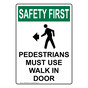 Portrait OSHA SAFETY FIRST Pedestrians Must Use Walk In Door Sign With Symbol OSEP-29893