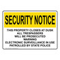 OSHA SECURITY NOTICE This Property Closes At Dusk All Trespassers Sign OUE-35035