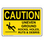 OSHA CAUTION Uneven Ground Rocks, Holes, Sign With Symbol OCE-28407